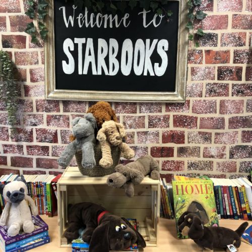 reading dogs with Starbooks sign.jpg